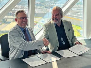 Jody Peacock (left), CEO of Ports of Indiana, and Wim Dillen, International Development Manager for Port of Antwerp-Bruges, shake hands on July 17.