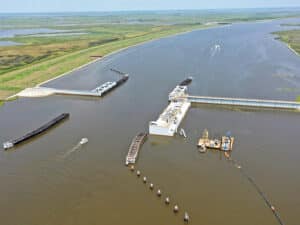 Once completed, the HNC Lock Complex will span 110 feet across and 800 feet in length with sector gates on either side, directly adjacent to the existing 250-foot-wide Bubba Dove barge floodgate.