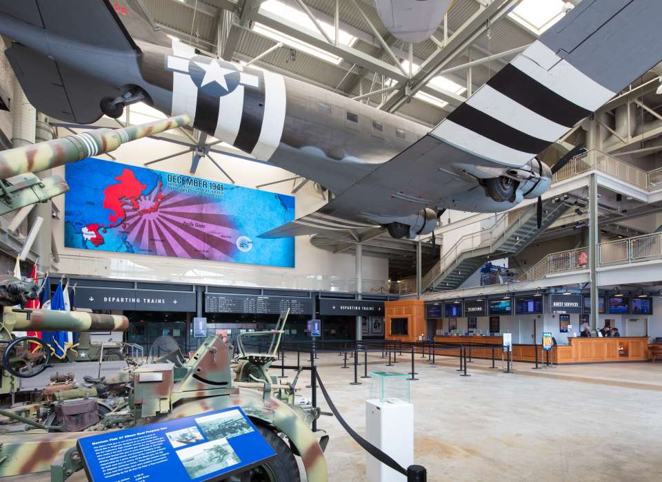 Photo of event space, including an airplane hanging from the ceiling.