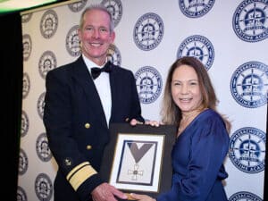 Rear Admiral Francis X. McDonald USMS, president of Massachusetts Maritime Academy and Liz Burdock.