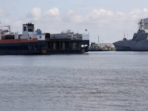 Ships sit in the channel of the Mobile Bay Harbor, Mobile, Ala., July 29, 2024.