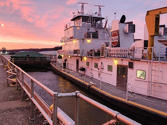 Ingram's M/V Neil N. Diehl towboat locks through Lock and Dam 2, in Hastings, Minnesota, March 19, with nine barges. (Credit: USACE)